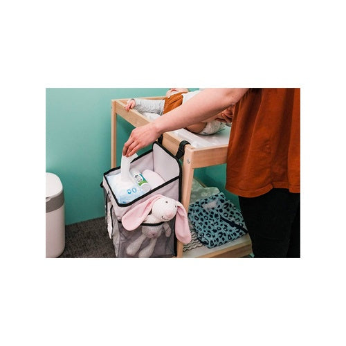 Baby changing station with storage basket for wipes and toys